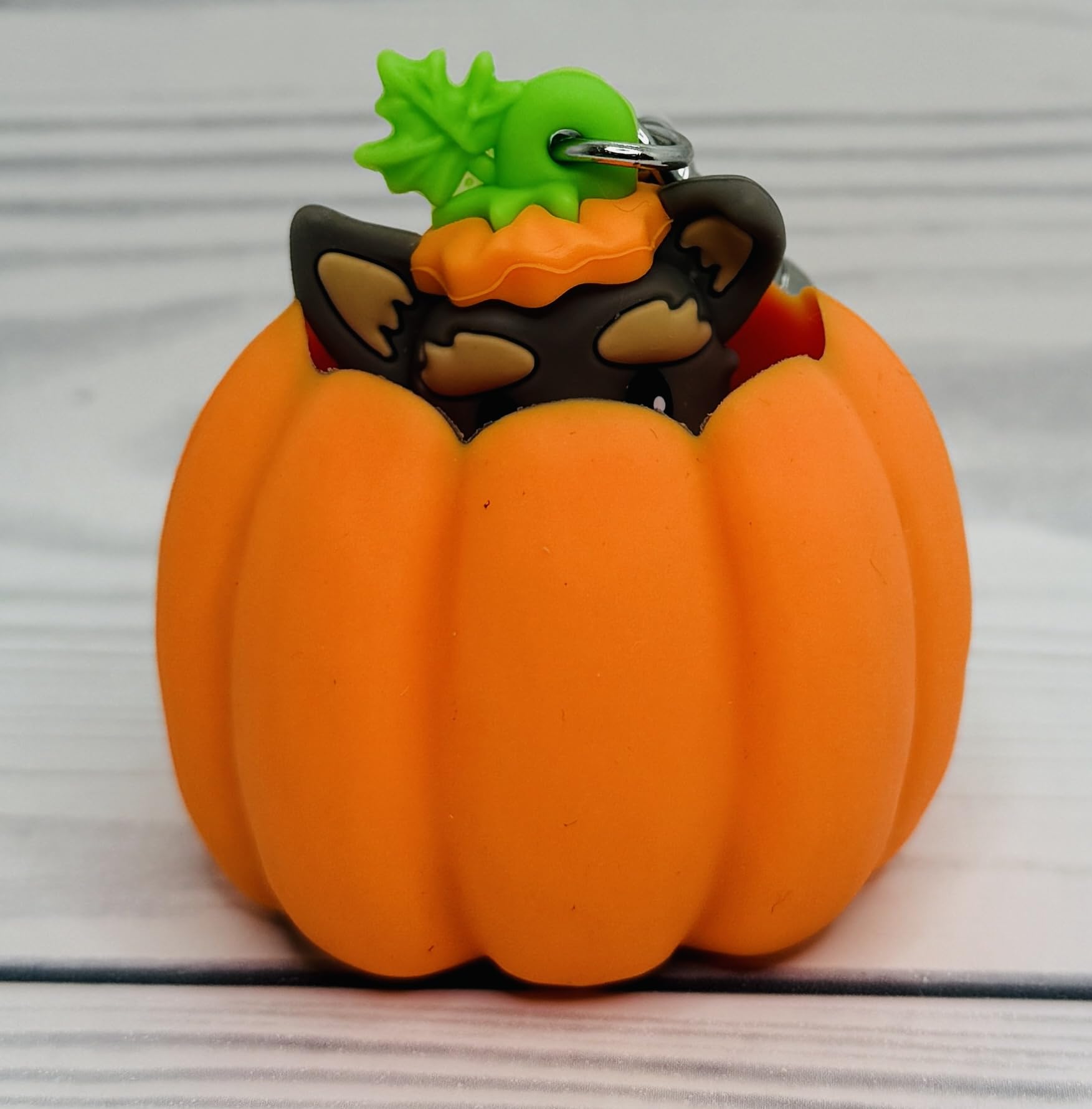 Bath & Body Works Pop-up Pup Pumpkin PocketBac Holder attached to a bag for quick sanitizer access.