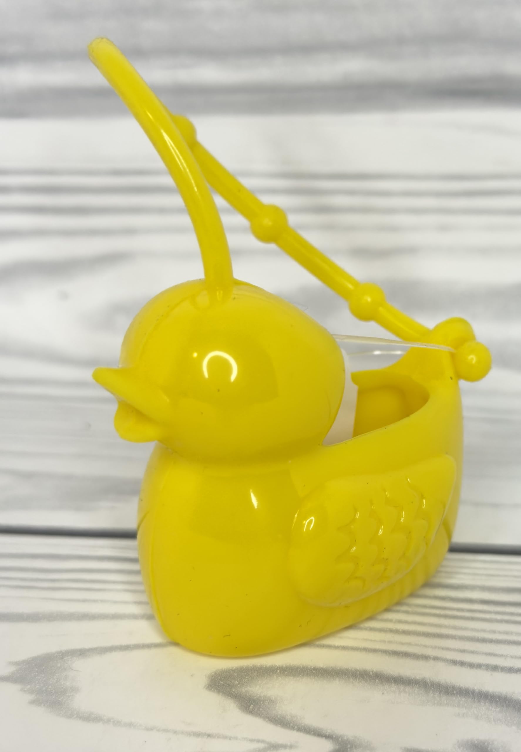 Bath & Body Works rubber duckie PocketBac attachment for easy on the go sanitizing.