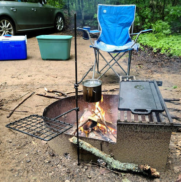 BATTLBOX Bushcraft Grill Set swiveling grills enabling flexible heat control for camp meals.