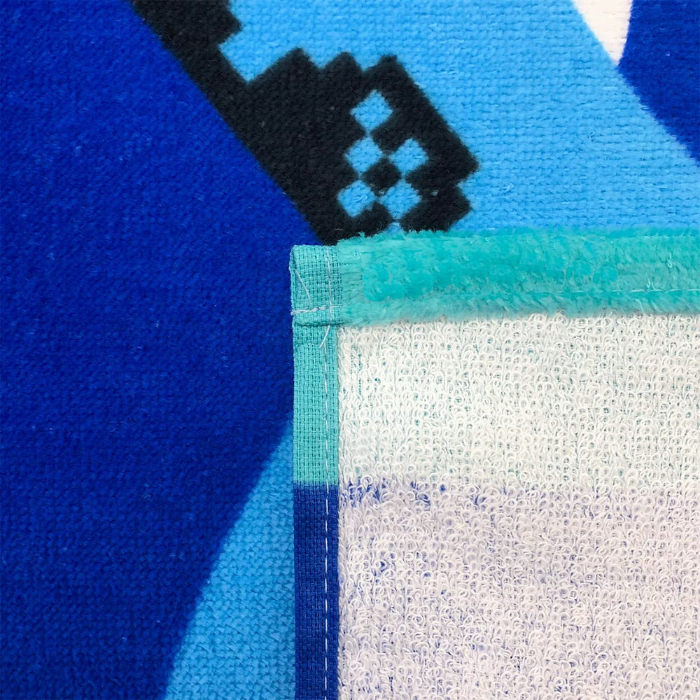 Beachland Sharks towel shows custom name embroidery option