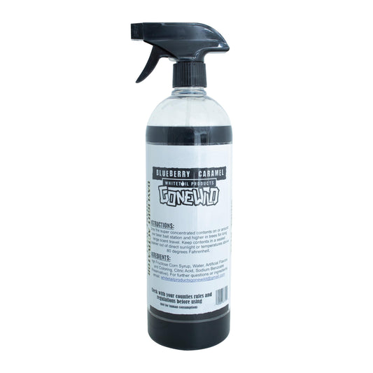 Bear attractant spray being applied at a bait site