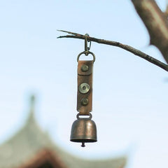 Bear Bell with PU leather strap ready for easy wear on gear.