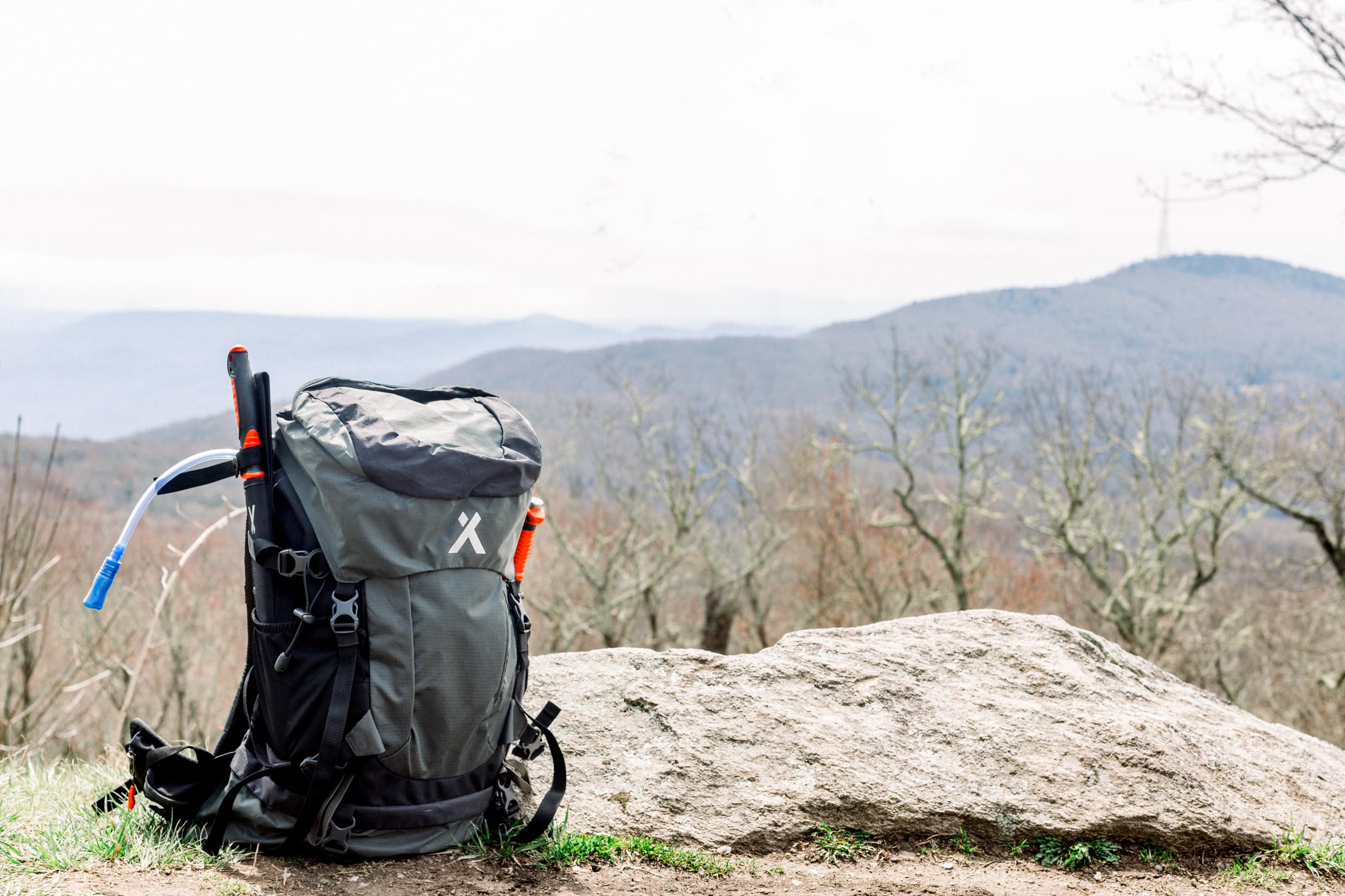 Bear Grylls 45L worn during hiking or cycling for versatile outdoor adventures.