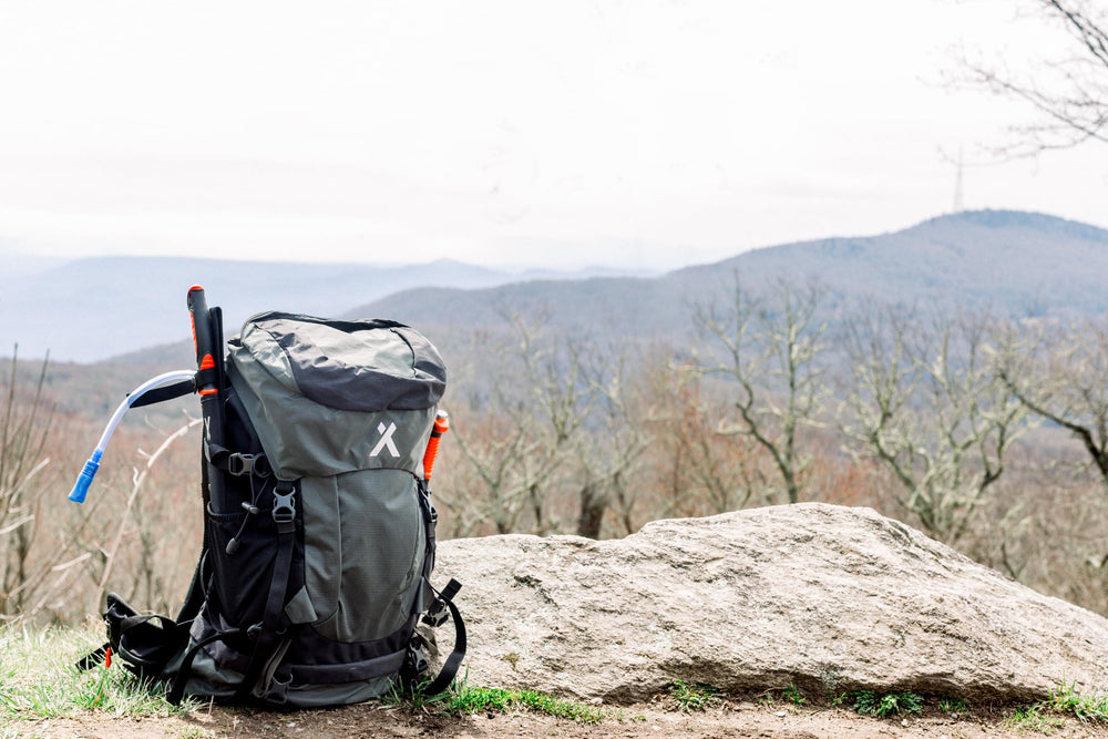 Bear Grylls 45L worn during hiking or cycling for versatile outdoor adventures.