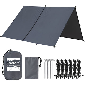Bearhard 10x10 tarp setup with hammock shows versatile shelter for camping and rain protection.