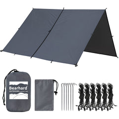 Bearhard 10x10 tarp setup with hammock shows versatile shelter for camping and rain protection.