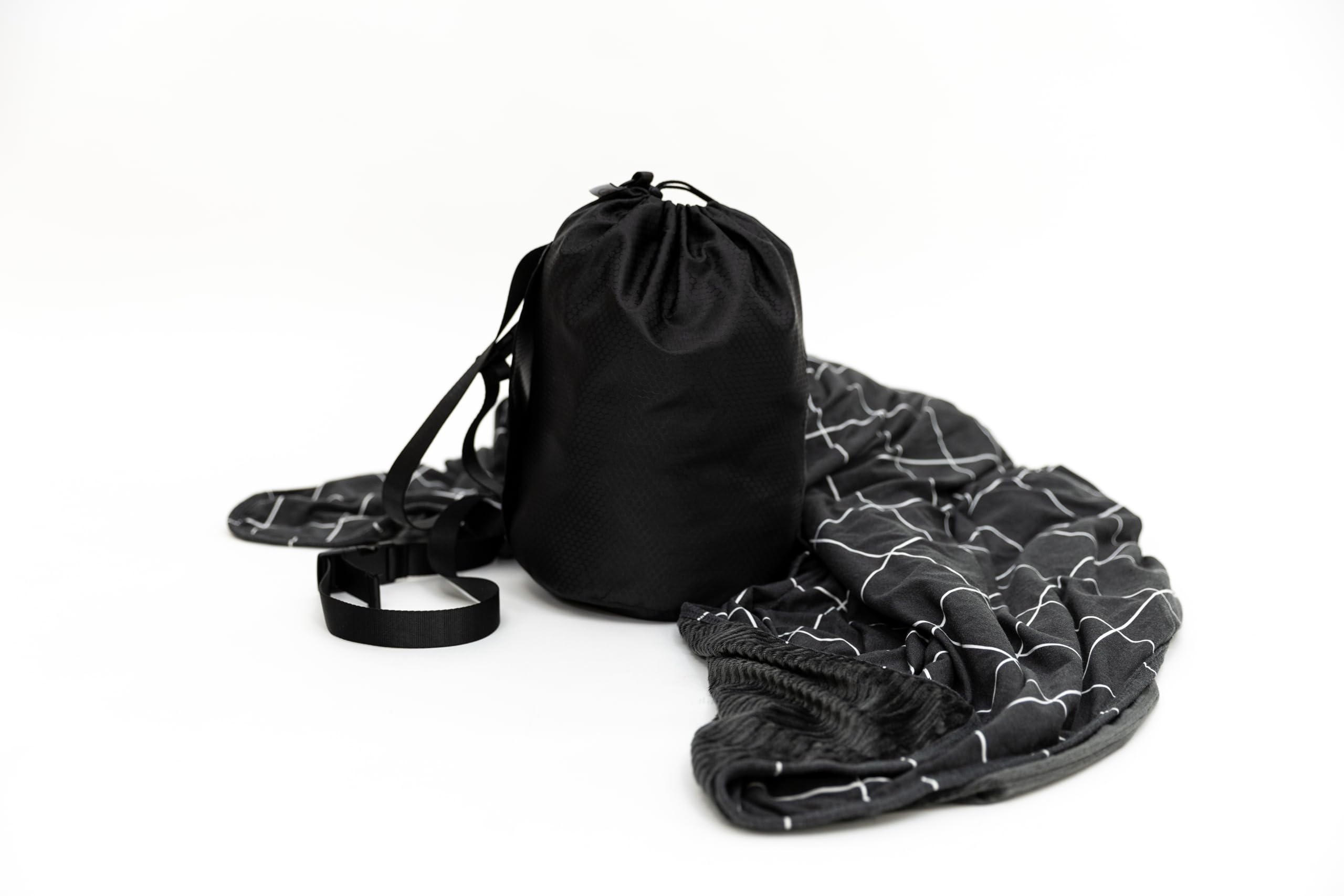 Beddy's dual-sided travel blanket in bag for portable comfort on the go