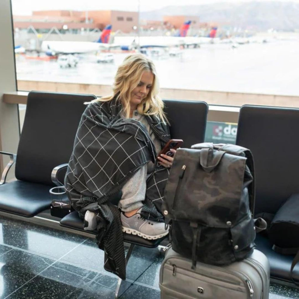 Beddy's dual-sided blanket opened flat for full-coverage warmth in car trips
