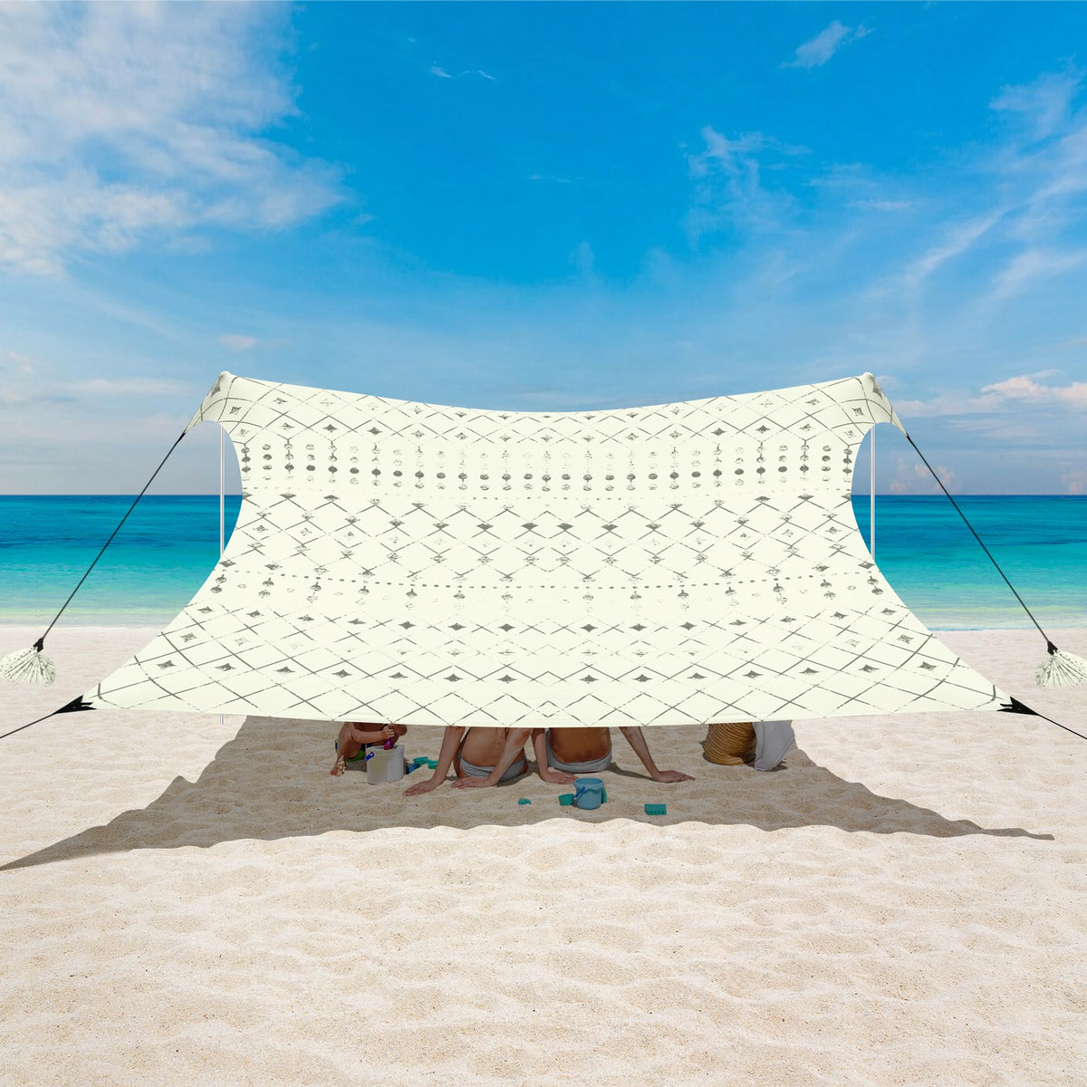 BEW Beach Tent UPF 50+ shade in use at the sunny shoreline.