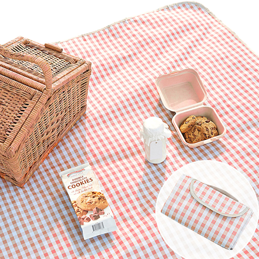 Beyond Thursday cute gingham picnic blanket in coral pink on the lawn—waterproof and easy to clean for picnics.