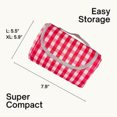 Beyond Thursday waterproof blanket protects belongings during a spill at the beach.
