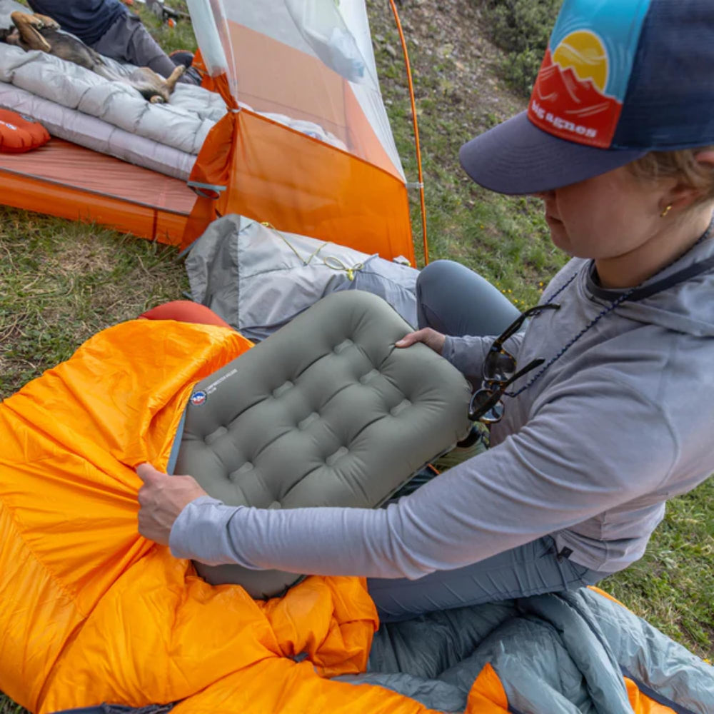 Big Agnes Campmeister Deluxe Pillow close-up inflating for quick setup and comfort.