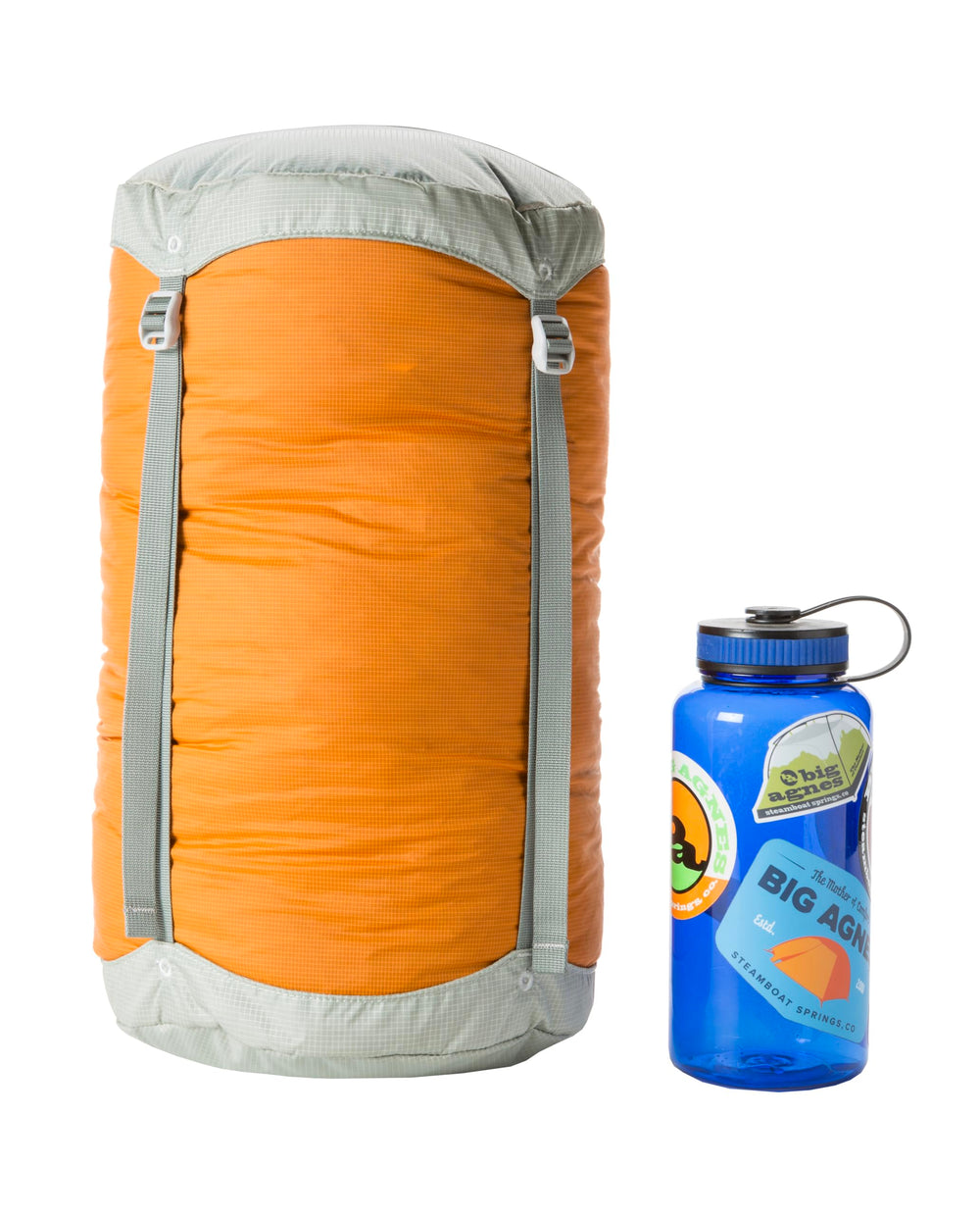 Big Agnes compression stuff sack Tangelo 20L with lid and straps for secure trail packing.