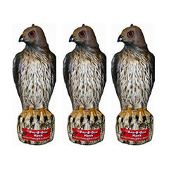 Bird-B-Gone Hawk Decoy deters birds and rabbits in a garden.