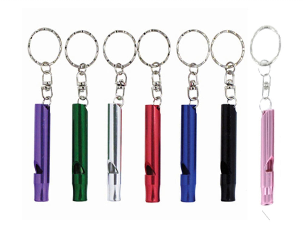 Bison whistle keychain in use attached to outdoor gear for quick access.