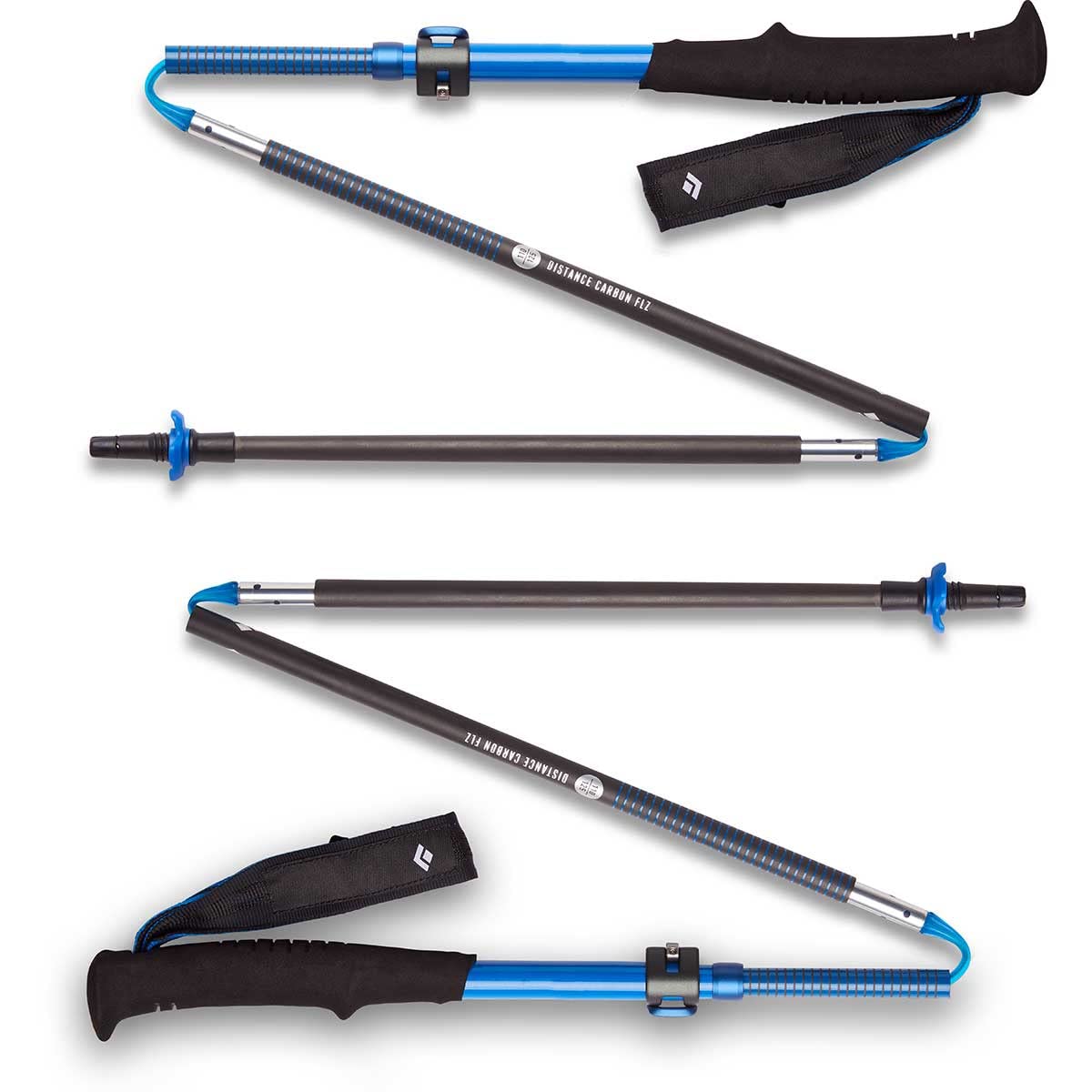 Black Diamond Distance Carbon FLZ trekking poles extended for hiking, ultralight stability on rugged terrain.