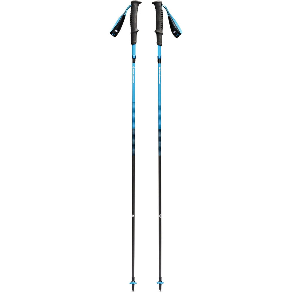 Black Diamond Distance Carbon Z trekking poles in desert sky extended for rugged mountain trails.