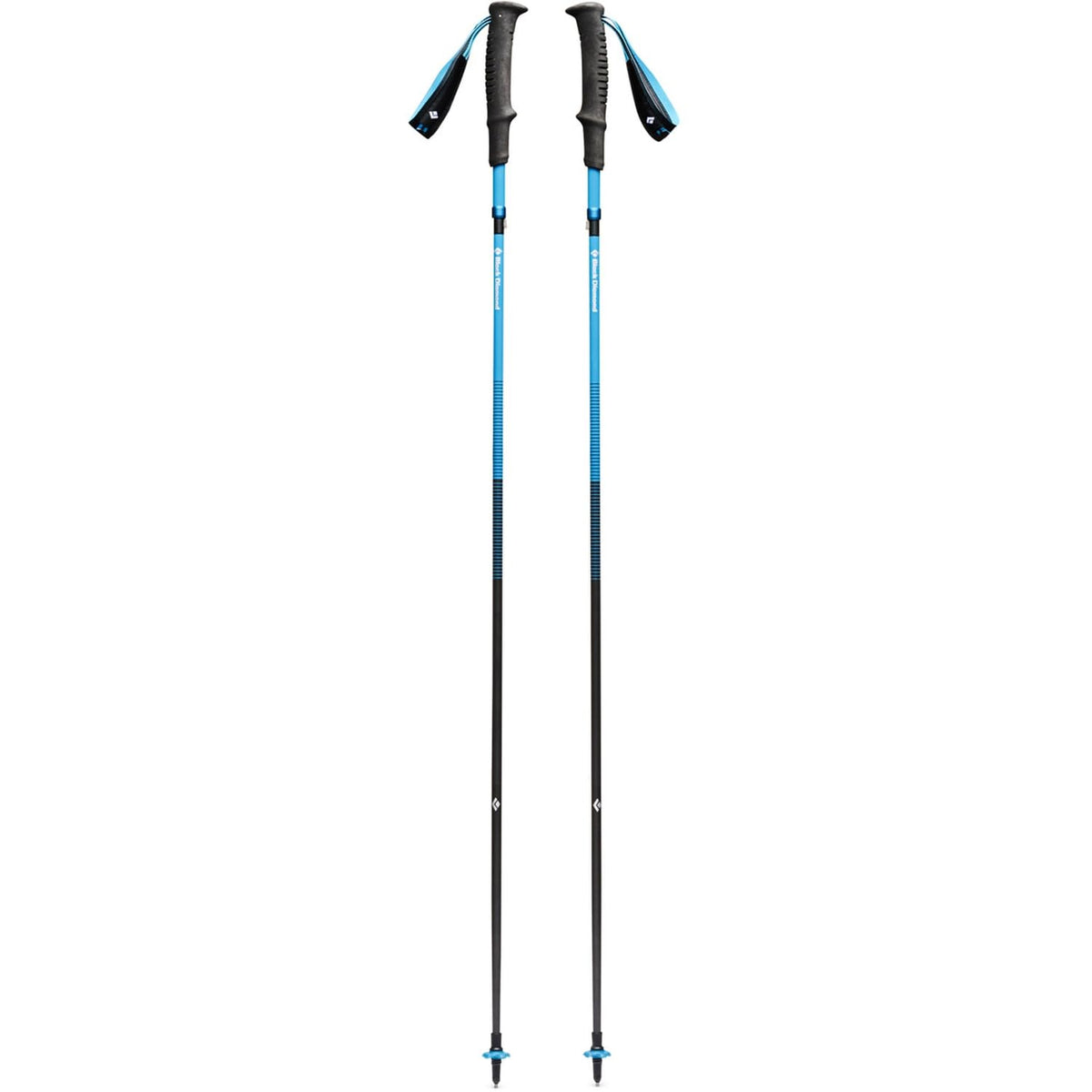 Black Diamond Distance Carbon Z trekking poles in desert sky extended for rugged mountain trails.