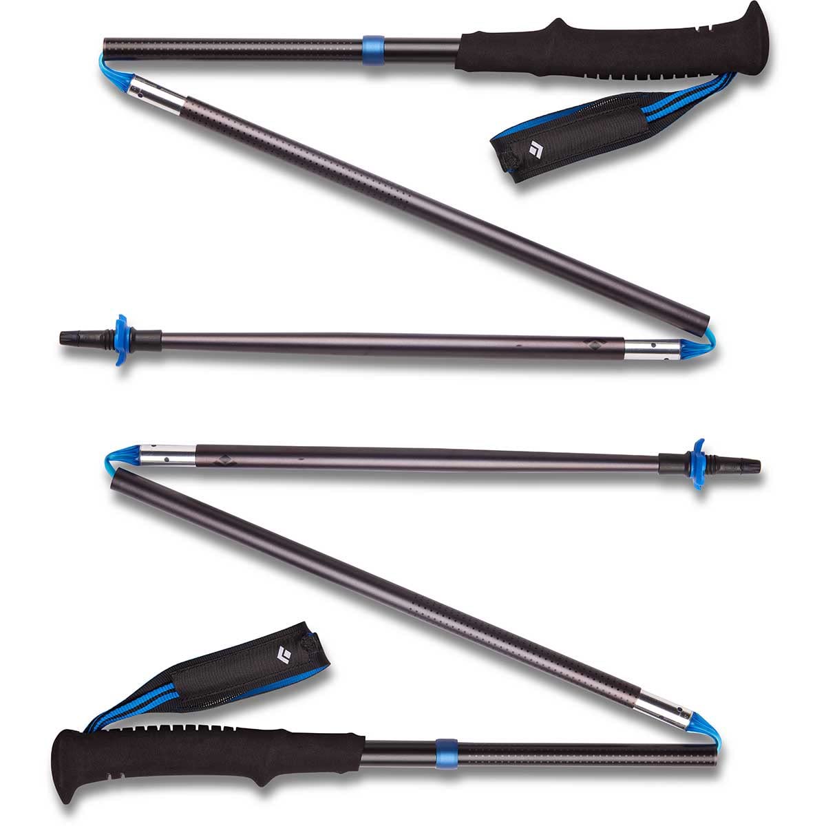 Black Diamond Distance Z trekking poles extended on trail offering stability for fastpacking.