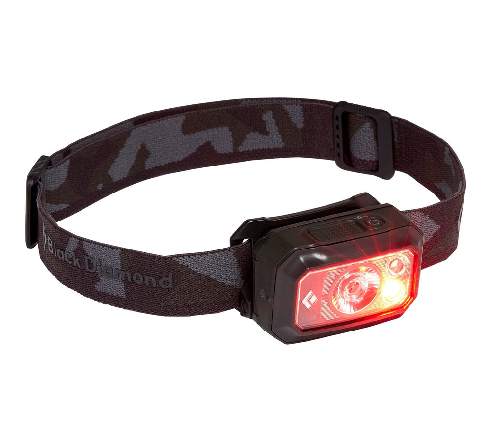 Black Diamond Storm 400 worn on head for hands-free illumination during trekking.