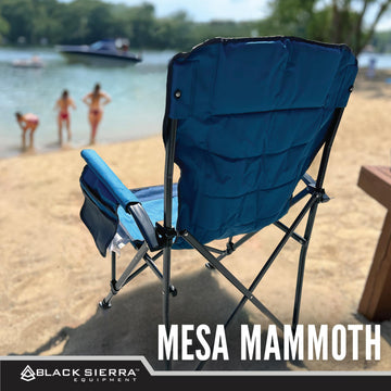 Black Sierra Equipment oversize chair folded with carry bag for portable travel.