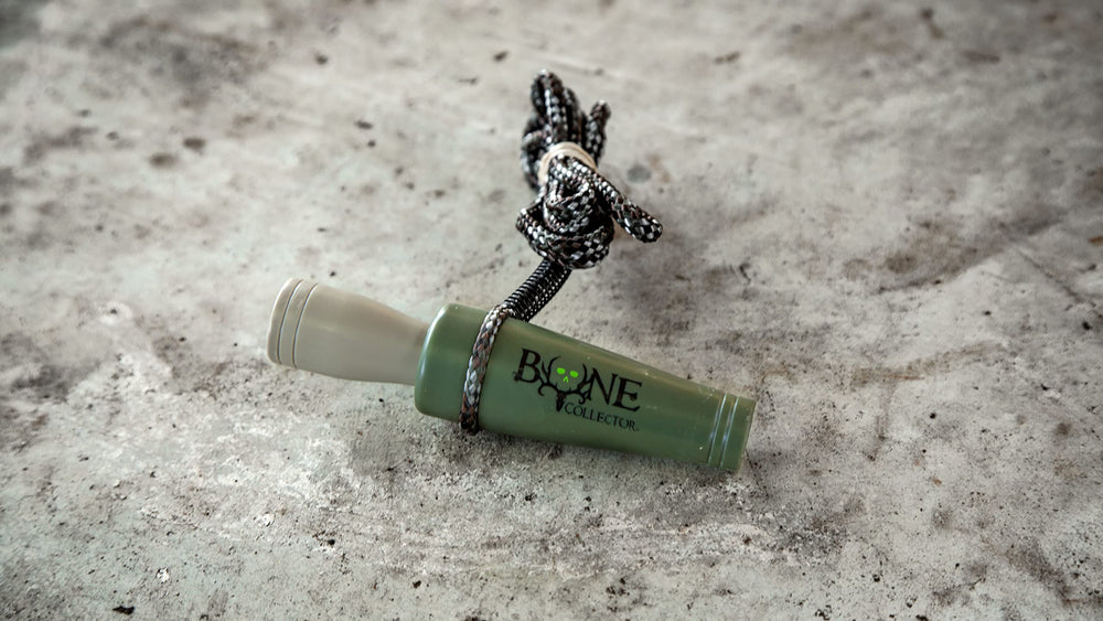 Bone Collector Doe Bleat Call in field setup demonstrates realistic estrous sounds.