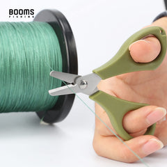 Close-up of serrated blade cutting braided fishing line