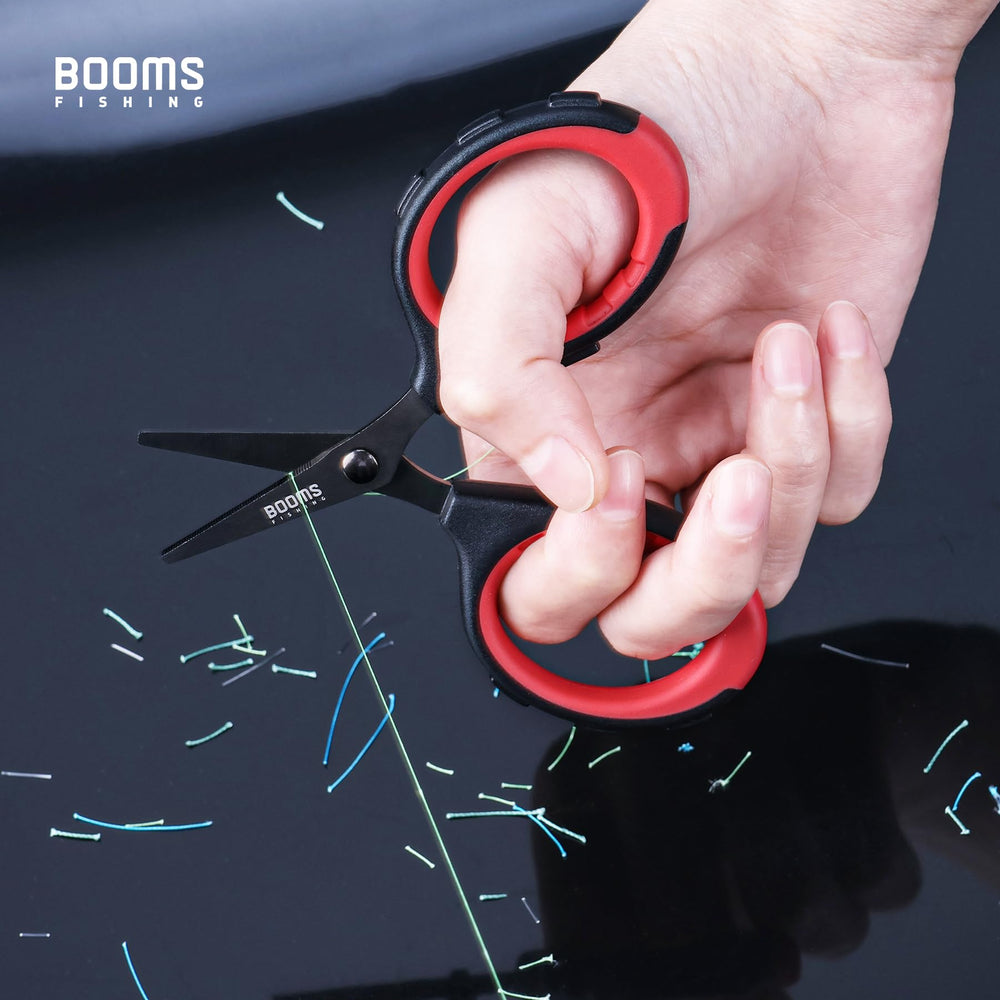 Close-up of serrated blade cutting braided fishing line