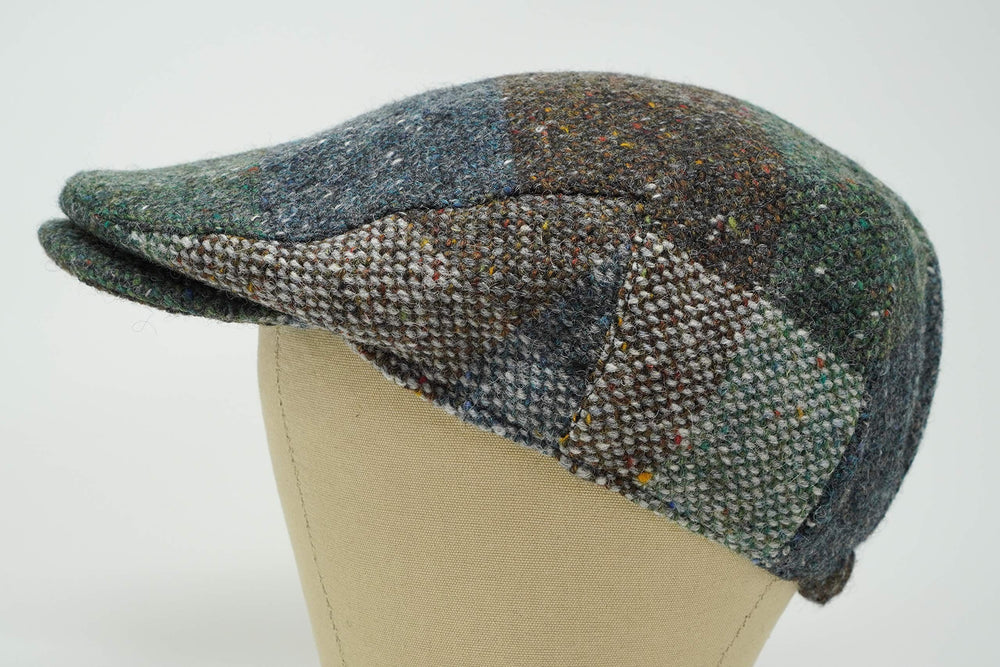 Galway patchwork tweed cap side view highlighting durable wool exterior