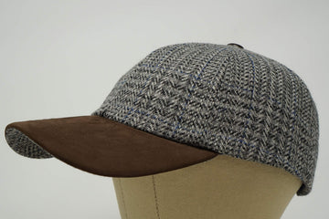 Nubuck peak detail on The Sligo cap emphasizes weather-ready craftsmanship.