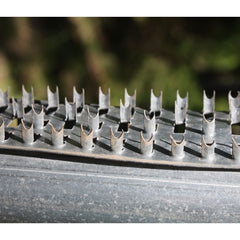 Mounted Shark Teeth Deterrent Strips on feeder lid and control box to deter raccoons and large birds