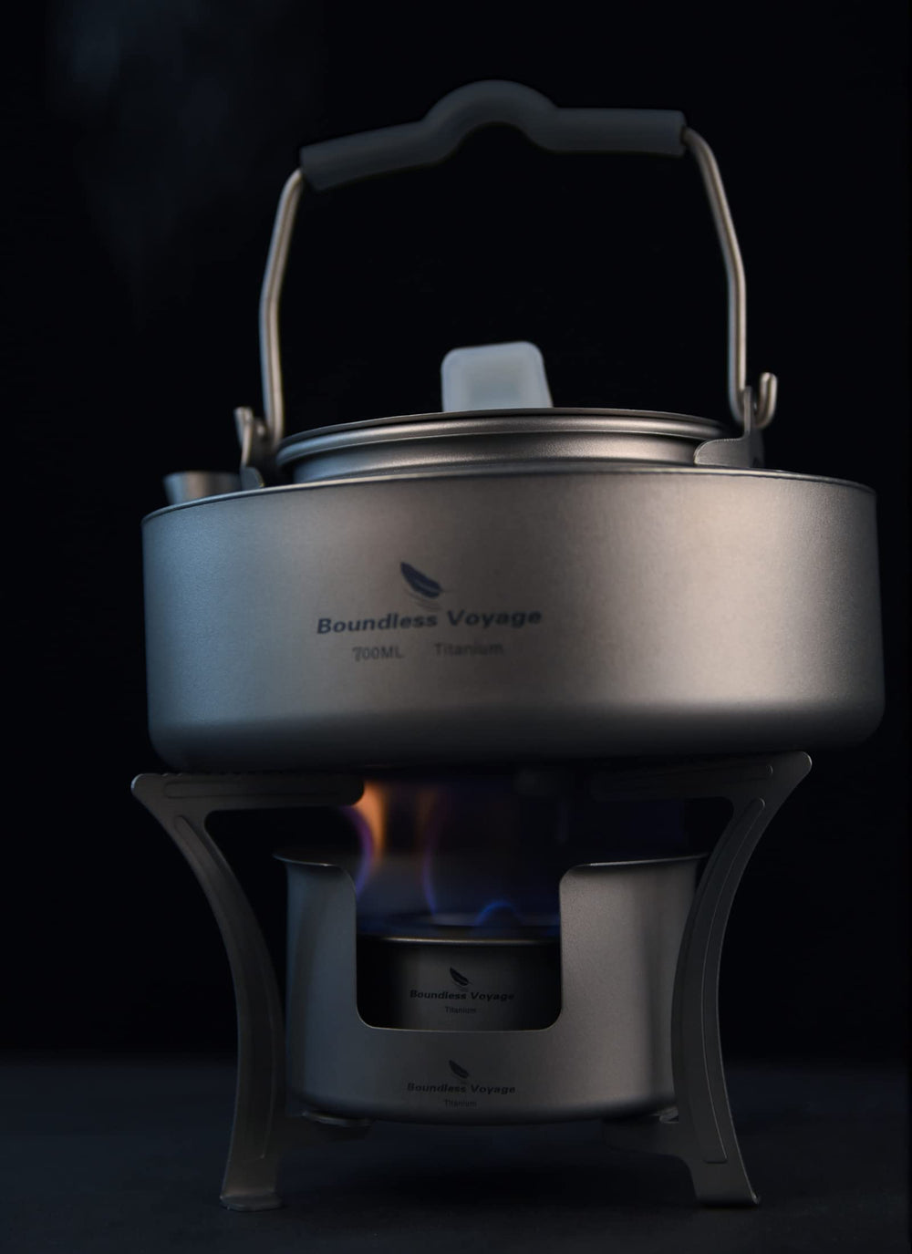 Boundless Voyage camping stove in use with kettle on a trail