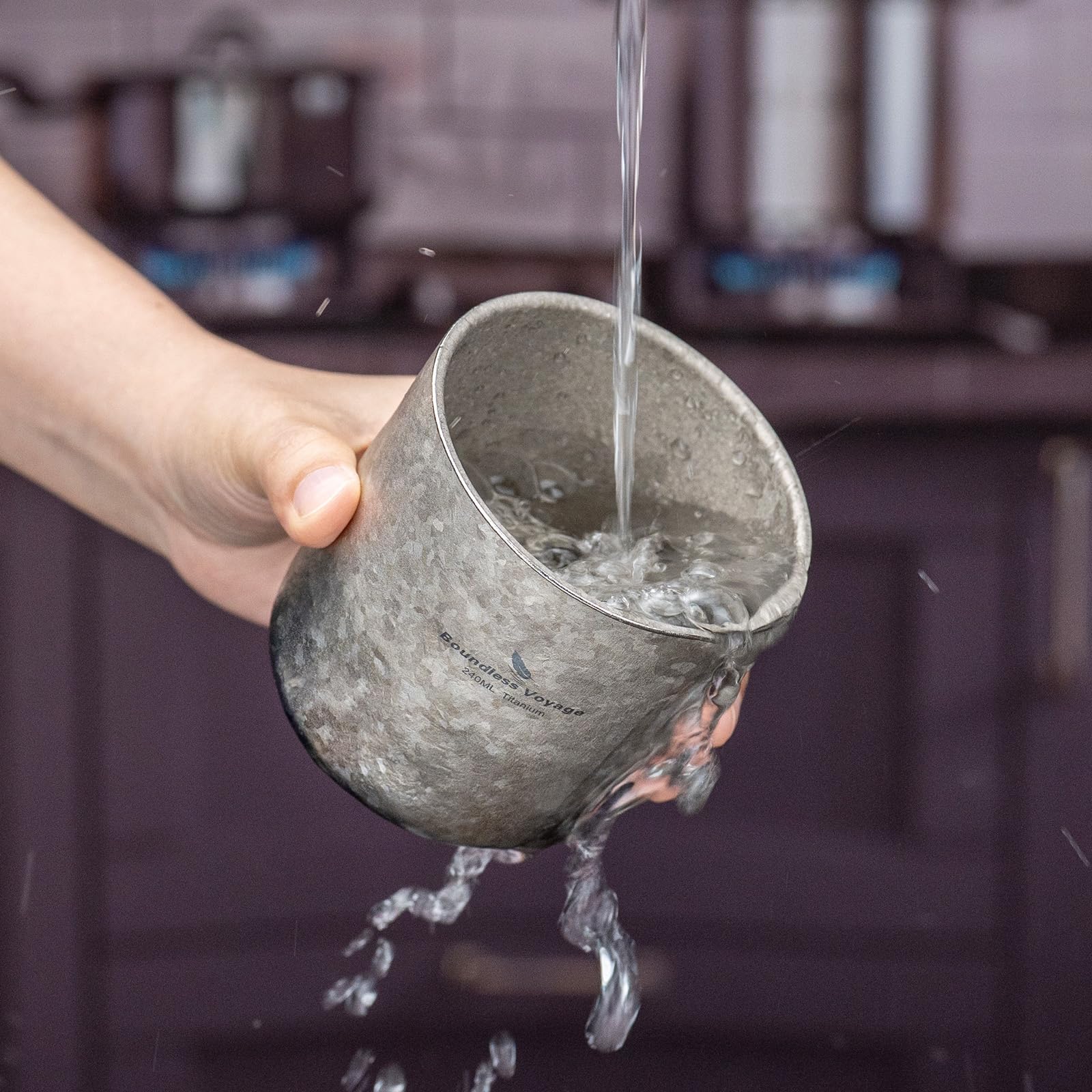 Boundless Voyage cup used outdoors during camping for hot or cold beverages.