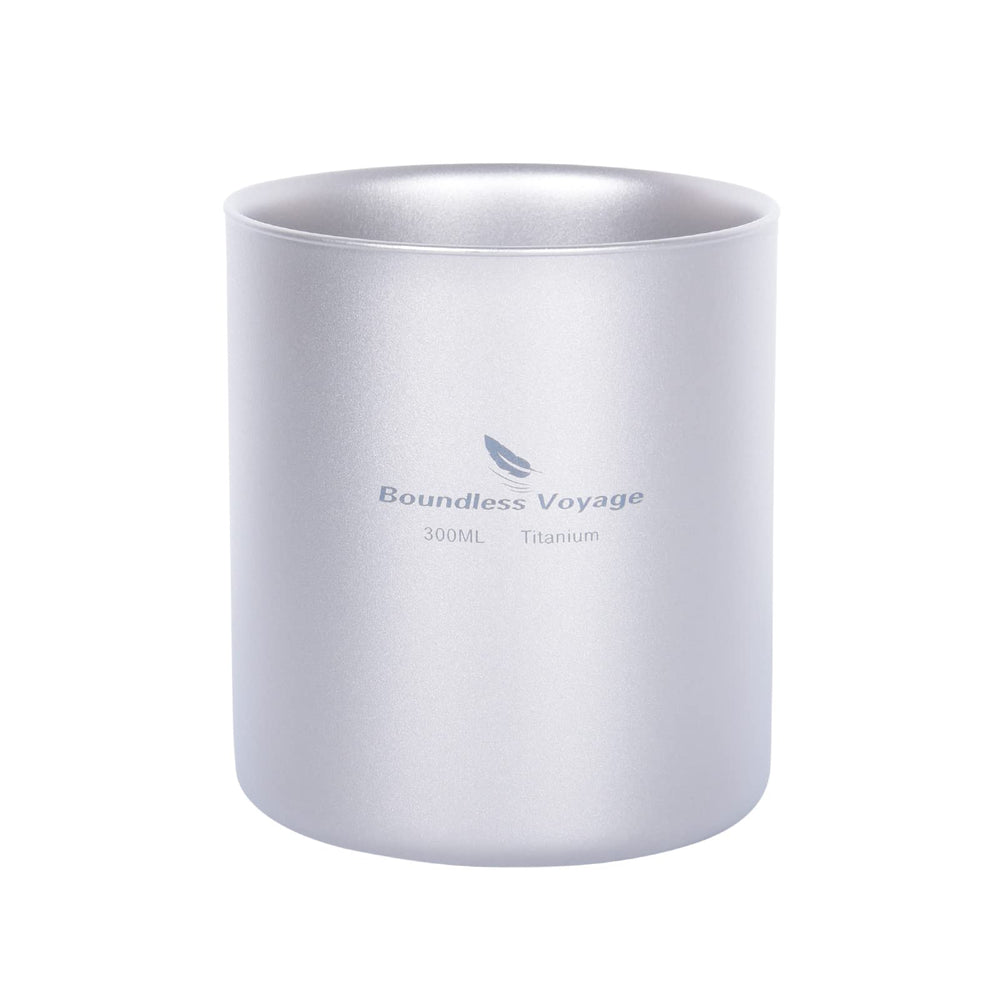 Boundless Voyage double-walled titanium cup shown with a pour, heat-protected grip on a campsite.