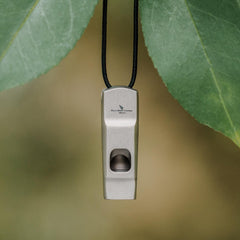 Boundless Voyage Ti9020 with lanyard attached to a backpack for easy access.