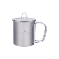 Boundless Voyage titanium cup with lid open, foldable handle for outdoor use