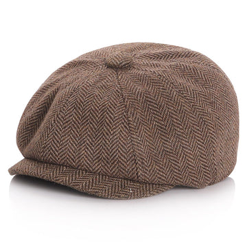 Kid wearing a coffee colored newsboy cap