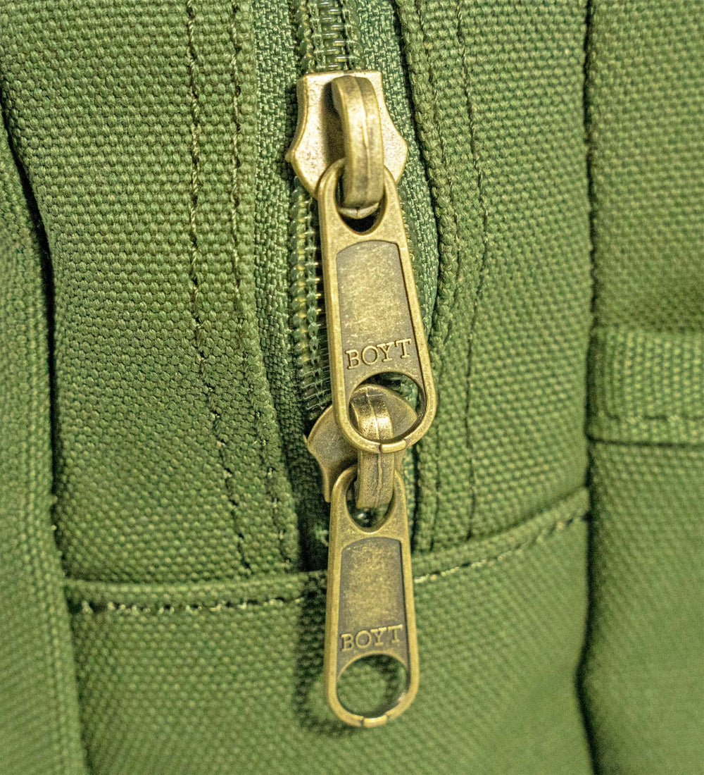 Boyt Harness Sporting Clays Bag OD Green demonstrates eight-box shell capacity.