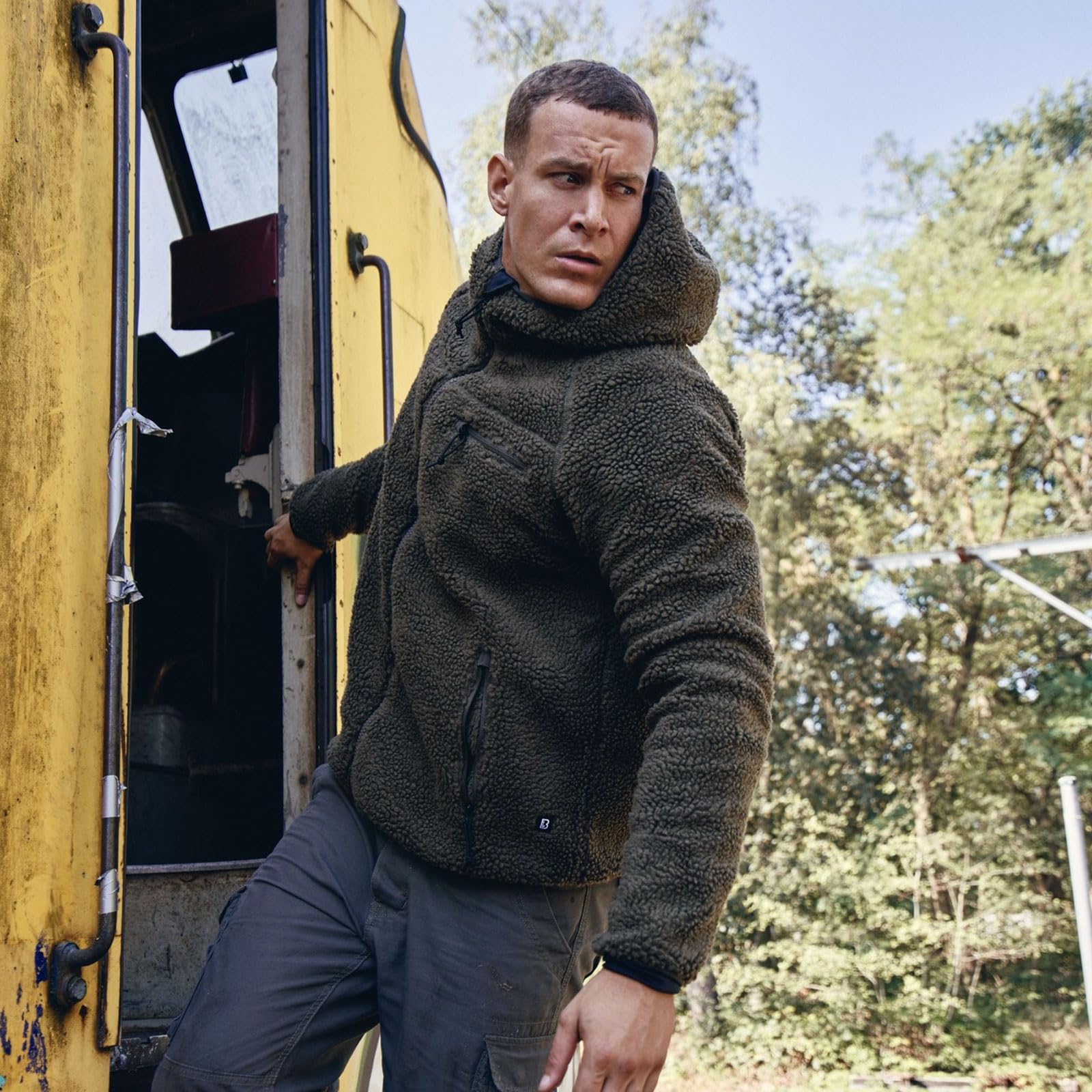 Brandit hooded fleece jacket olive wind protection strip visible against cold gusts