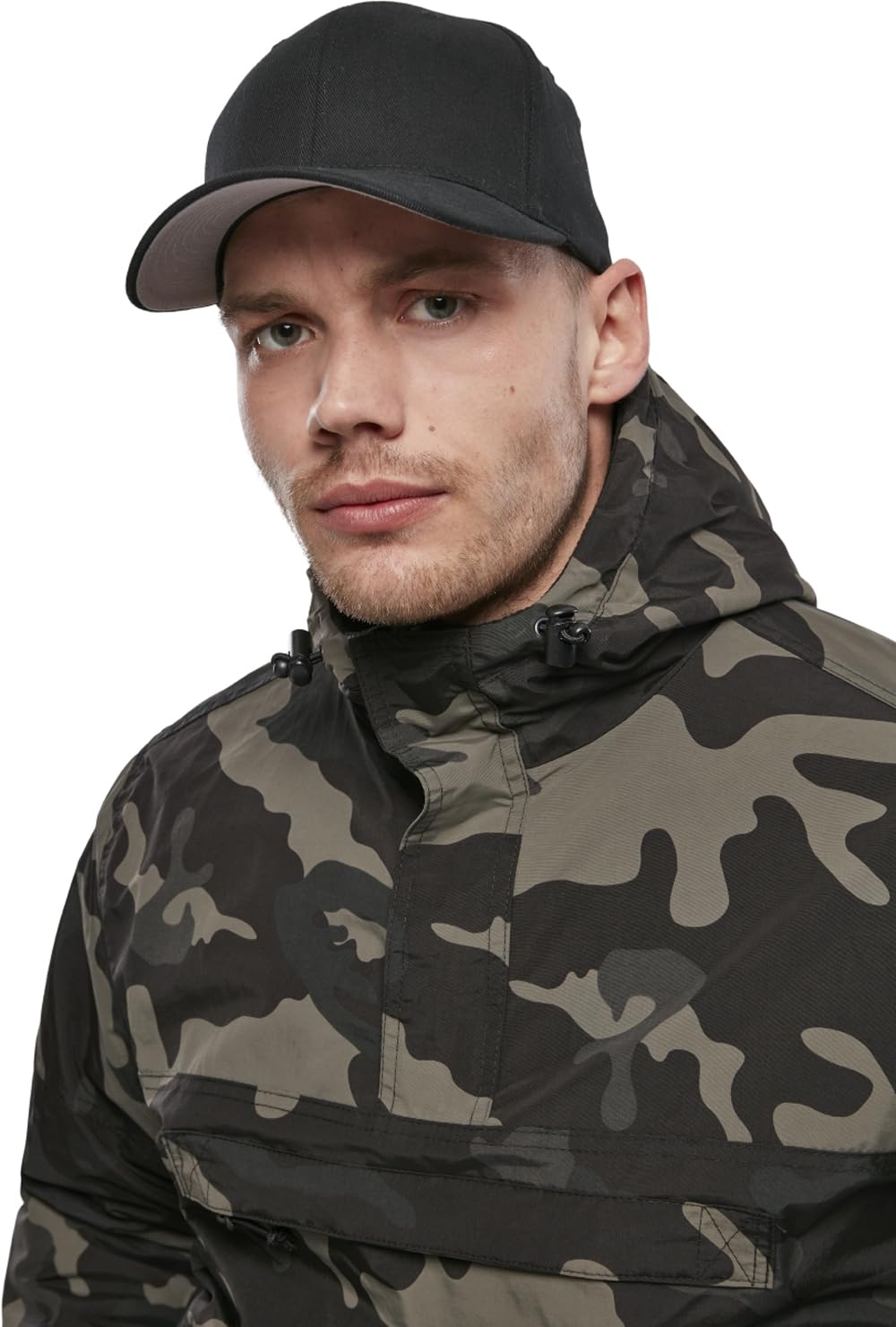 Brandit windbreaker side-zip design on-donning closeup illustrates easy wearing in varying conditions.