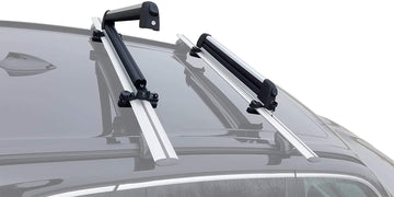 BRIGHTLINES ski and snowboard racks mounted on car roof for secure transport.