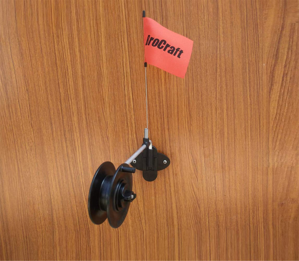Brocraft ice fishing rattle reel wall mount installed on an ice shanty wall