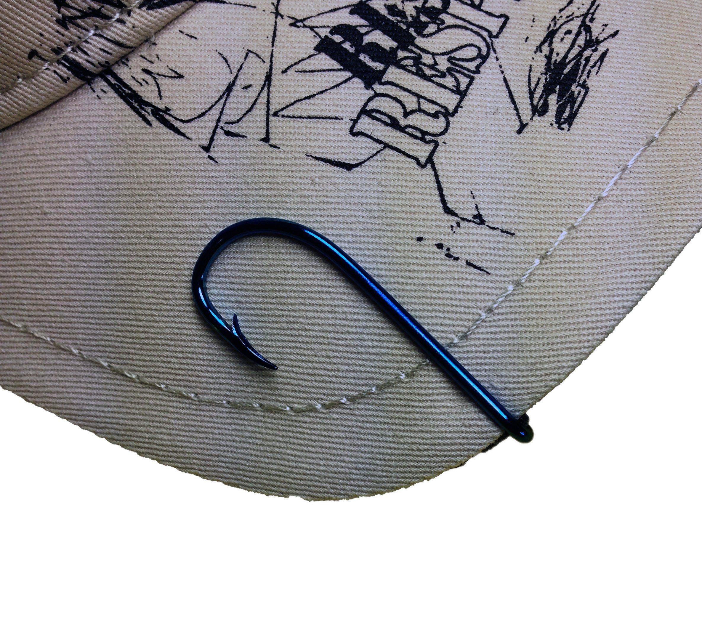 BT Outdoors blue hat hook used as tie clip for a refined look.