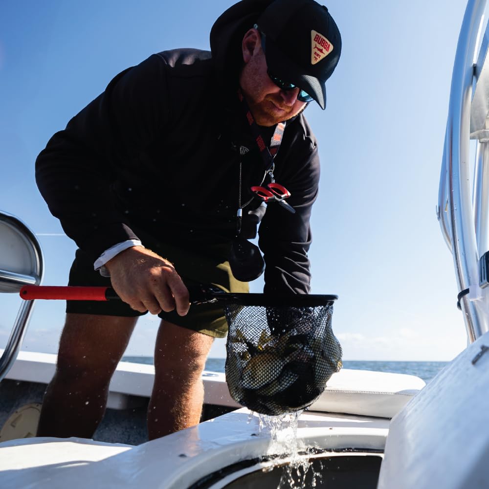 BUBBA dip net with 14-inch handle enhances reach on a boat.