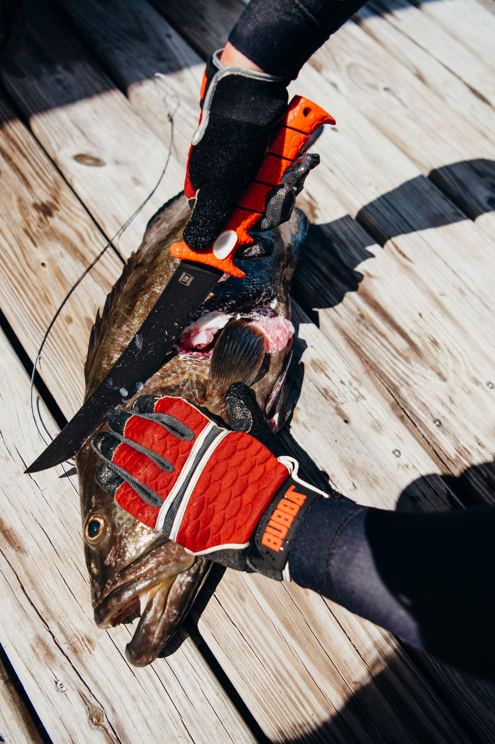 Pair of BUBBA Ultimate Fishing Gloves in product shot