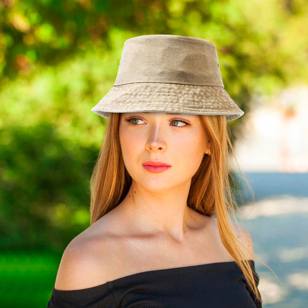 All four hats displayed together with travel accessories