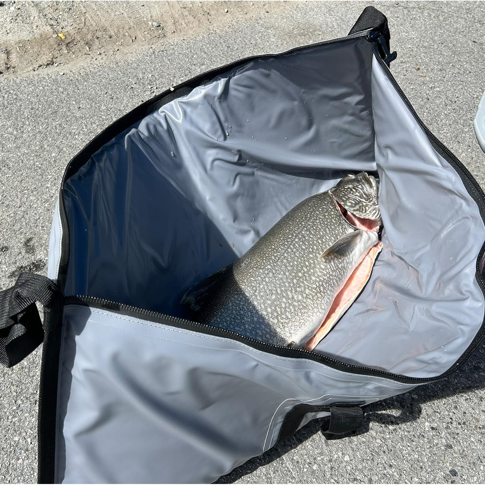 Buffalo Gear insulated fish cooler bag packed on a boat demonstrates space-saving setup.