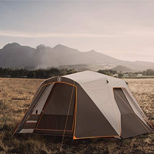 Bushnell Instant Tent family camping scene at sunset for versatile 3-season use.