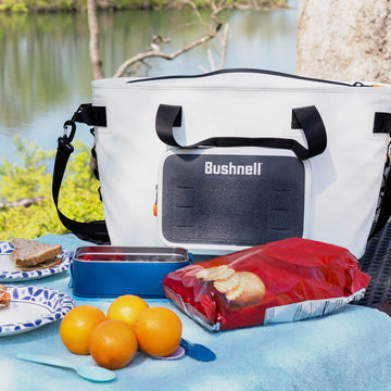 Bushnell Soft Cooler interior with drinks and ice, ready to keep items cold.