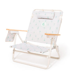 Business & Pleasure Co. Margaritaville Manana backpack chair in recline mode for beach comfort.